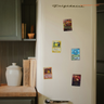 Card magnets on a vintage fridge
