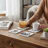Steamboat Willie coasters styled on a cozy coffee table